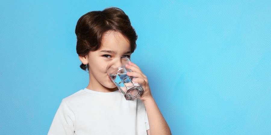 boy-drinking-water-from-glass